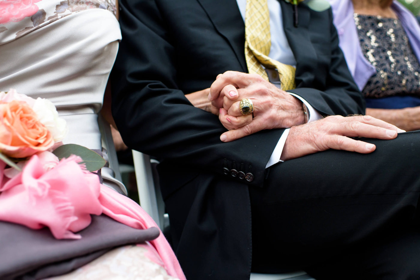 wedding ceremony parents hold hands