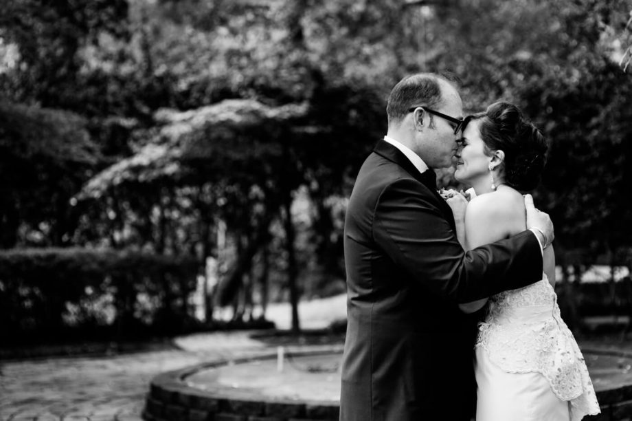 groom bride nose kiss portrait black and white