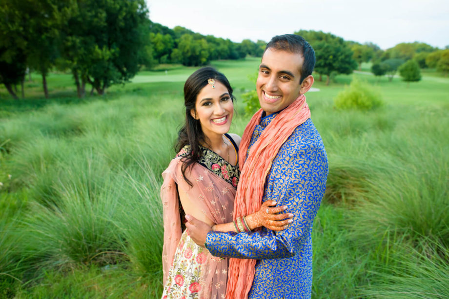 Indian bride groom smiling portrait grass field