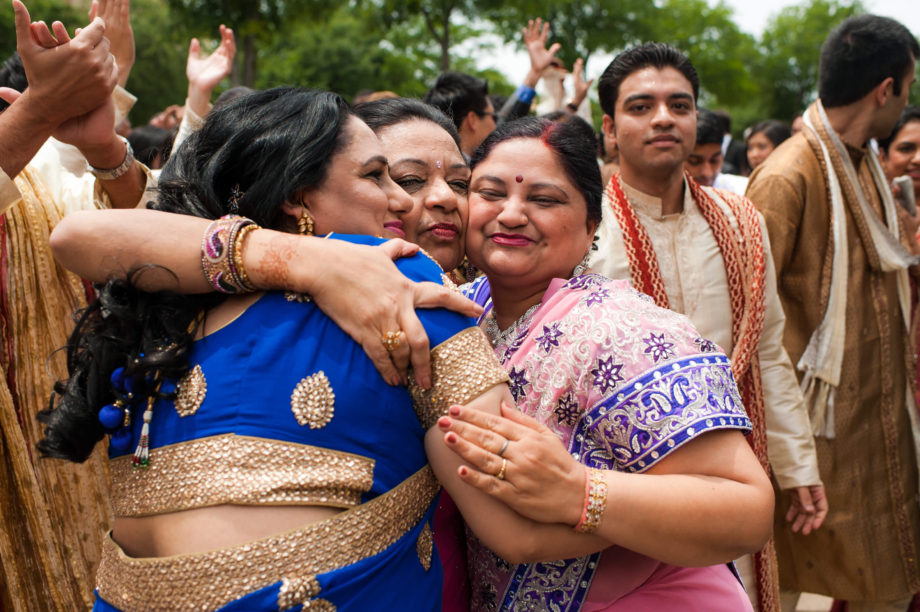 Indian wedding guests hugging love women friends Hotel Intercontinental Dallas