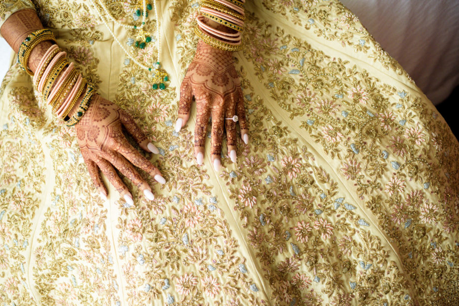 Indian bride wedding details dress lehenga bangles henna
